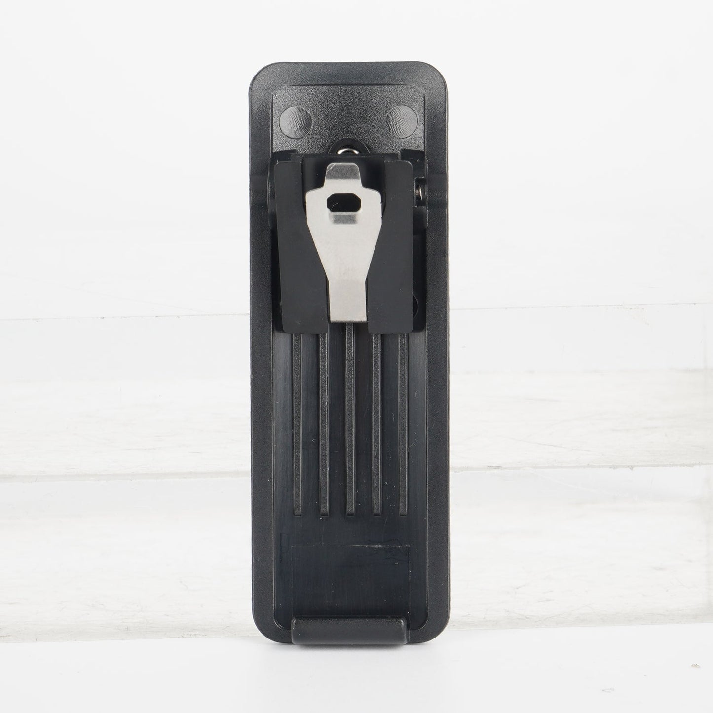 Black multi-tool with silver accents and a bottle opener design, resembling gerber brand.