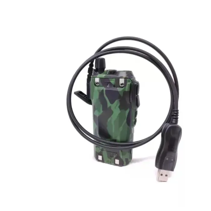 Camouflage two-way radio with USB cable.