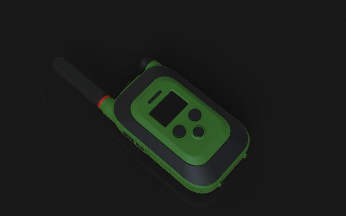 A green and black walkie-talkie on a dark surface