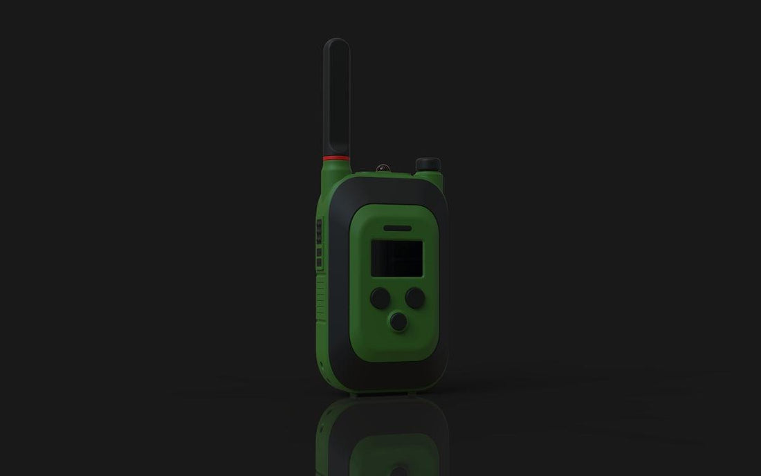 A green and gray walkie-talkie on a dark background.