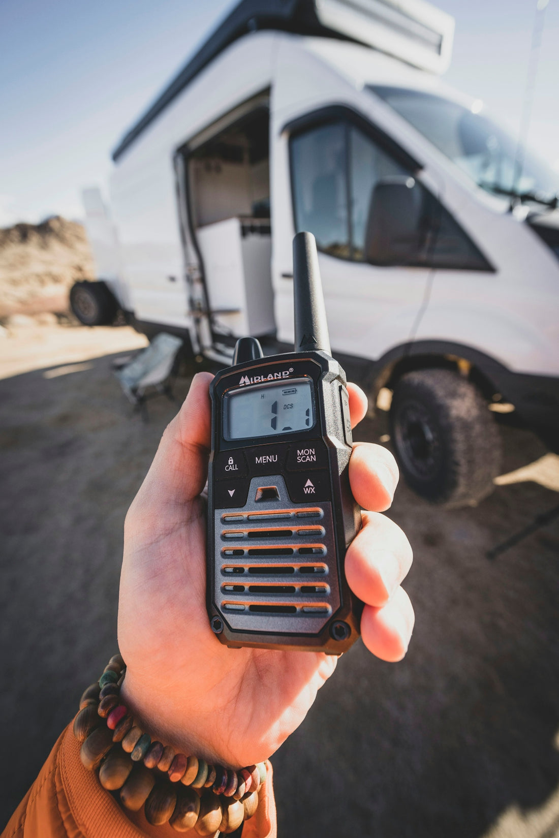 a person holding a radio in their hand