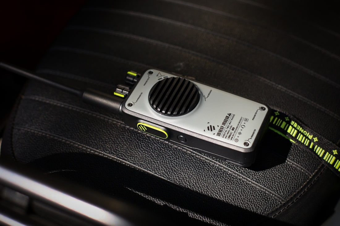 A walkie-talkie sits on a car seat.