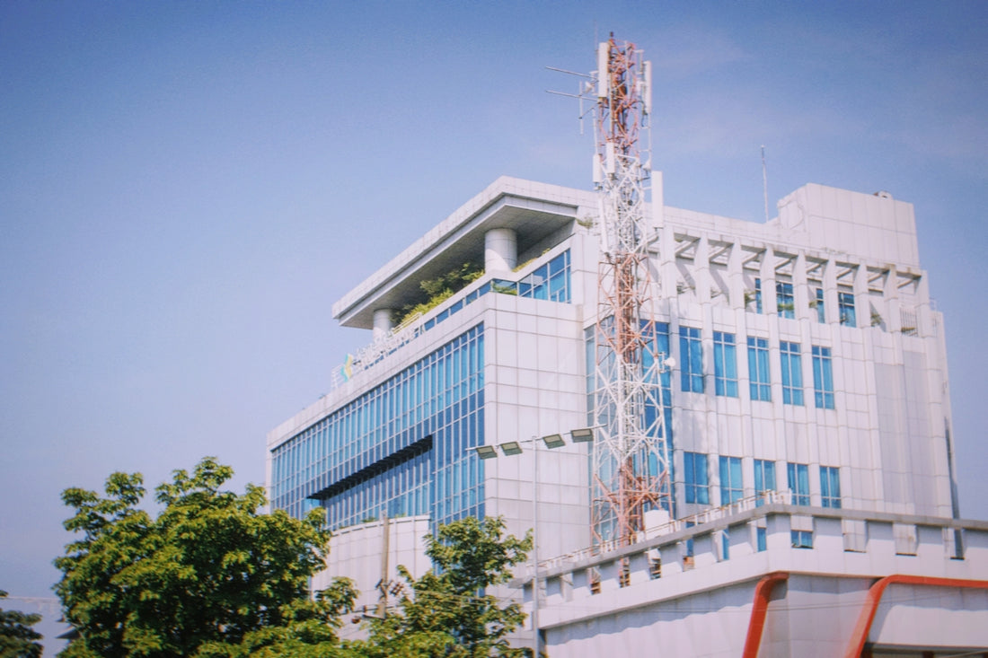 Modern office building with a telecommunications tower.