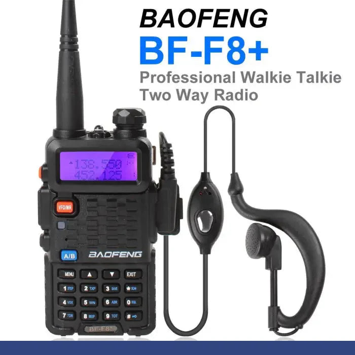 Black two-way radio with an earpiece and microphone.