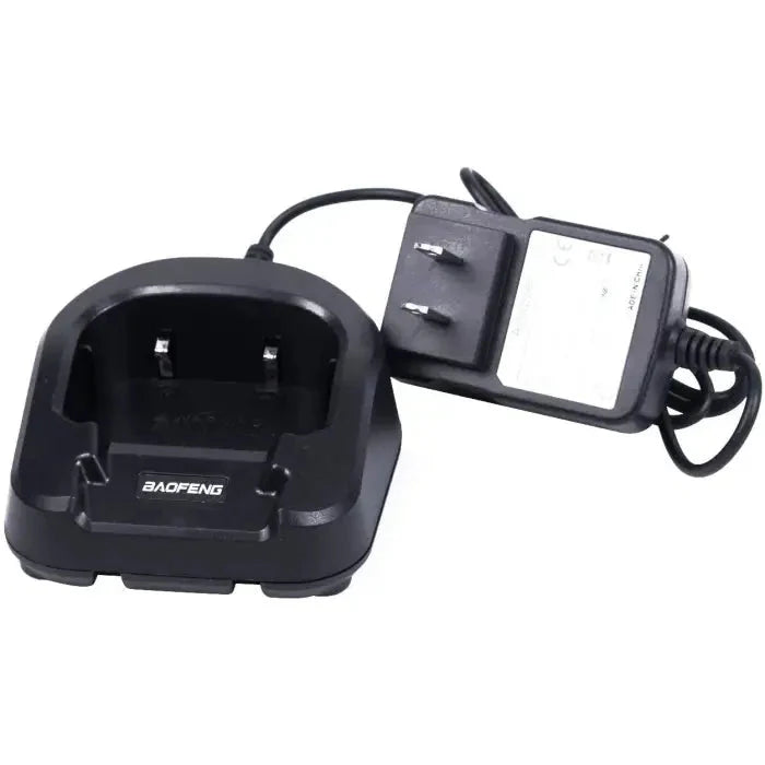 Baofeng charging dock with attached power adapter for handheld radios.