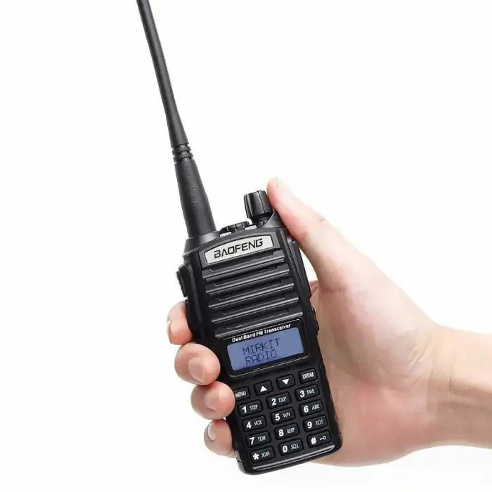 Black handheld two-way radio with an antenna and keypad.