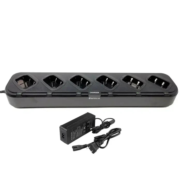 A black multi-bay battery charger with a power adapter and cable.