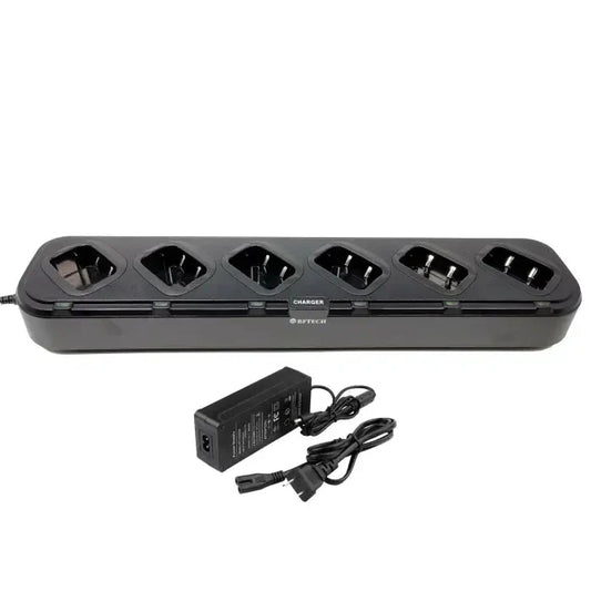 A black multi-bay battery charger with a power adapter and cable.