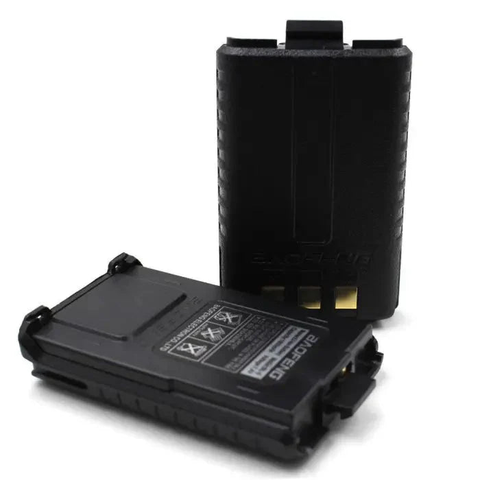 Two black Baofeng walkie-talkie batteries.