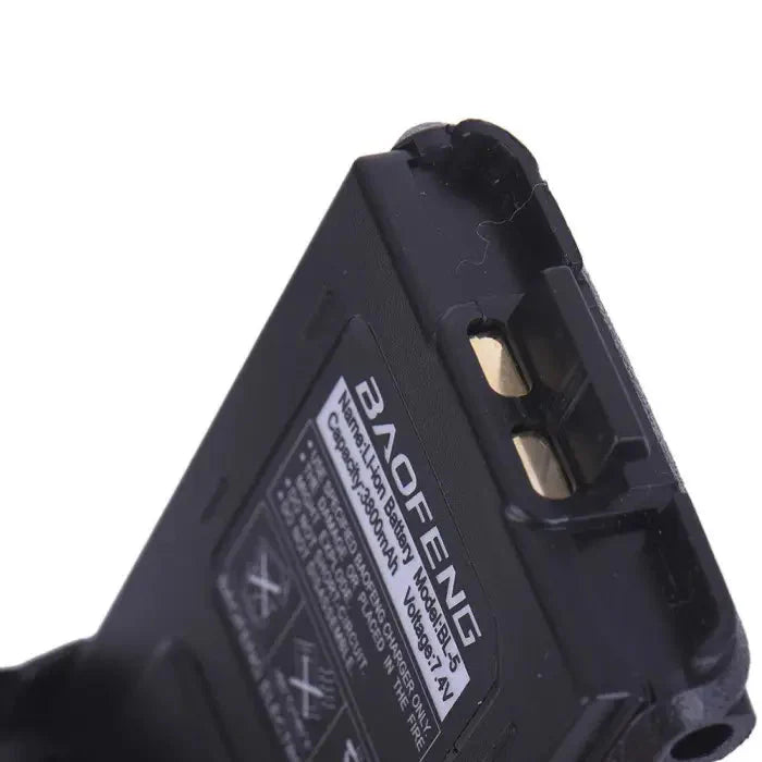 Black rectangular rechargeable battery with visible gold-colored contacts.