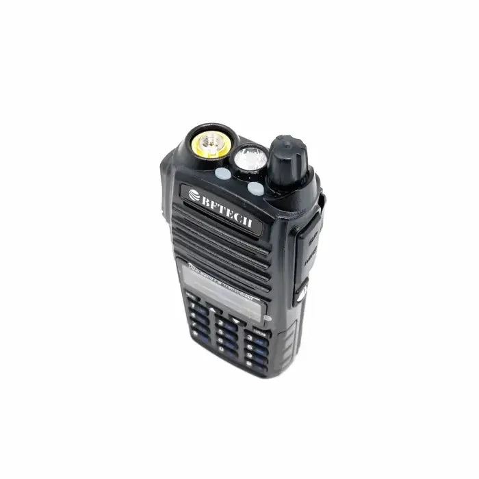 Black two-way radio with a keypad and a flashlight.