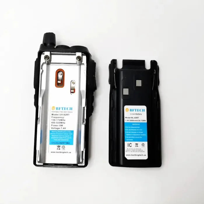 Two-way radio with its battery pack, featuring model numbers, frequencies, power, and voltage.