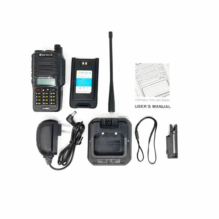A black portable two-way radio with its accessories, including a battery, antenna, charger, user manual, and belt clip.