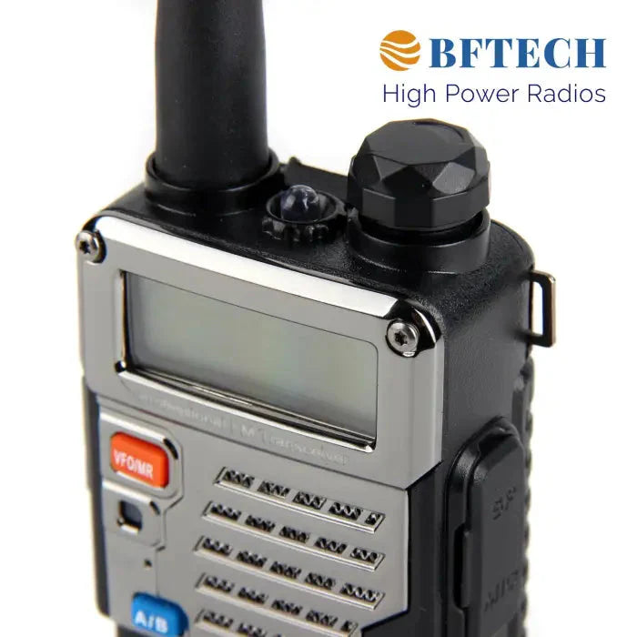 Black and chrome two-way radio with a display screen