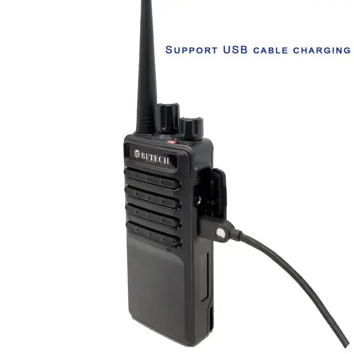Black two-way radio with USB cable charging capability.