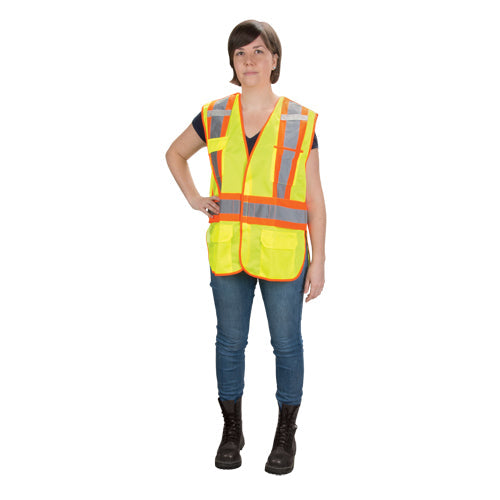 A woman modeling a bright yellow safety vest with orange and silver reflective strips.