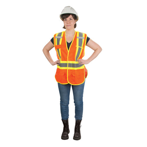 A woman wearing an orange safety vest, blue jeans, and a white hard hat.