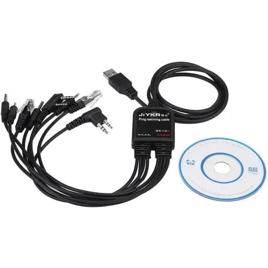 Black programming cable with multiple connectors and a driver disc.