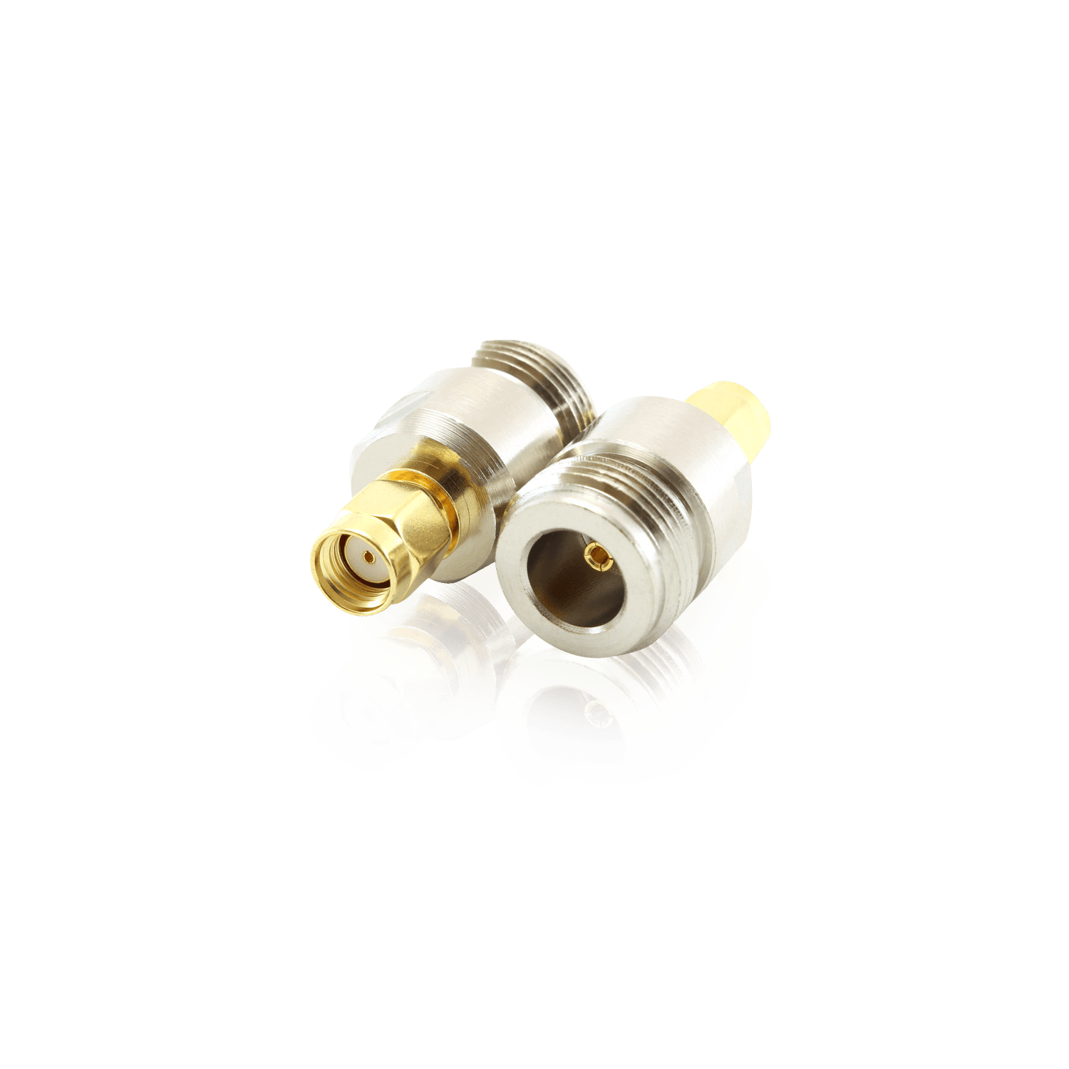 Four RF coaxial adapters with silver and gold-plated finishes.