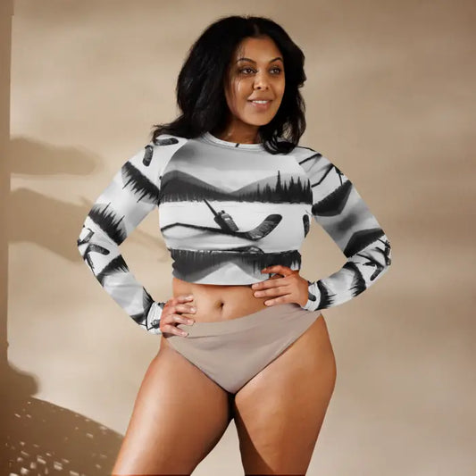 Woman wearing a long-sleeved crop top and briefs.