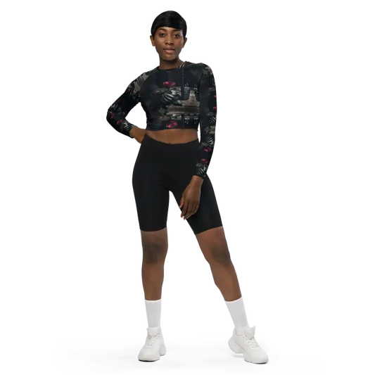 Woman in cropped top and biker shorts.
