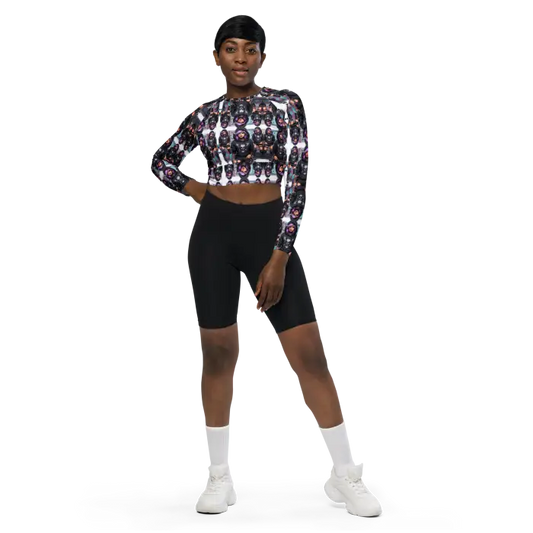 Woman in patterned crop top and black shorts.