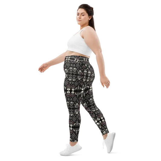 Woman wearing skull-patterned leggings.