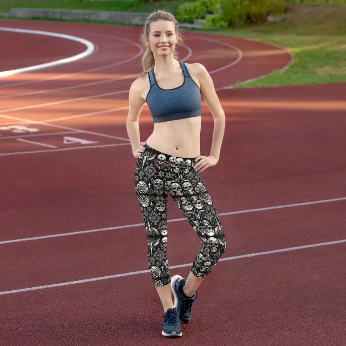 Woman in skull-patterned leggings.