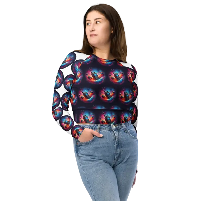 Woman wearing patterned crop top and jeans.