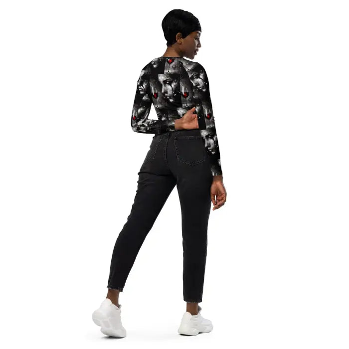 Woman’s black patterned long-sleeve shirt and jeans.