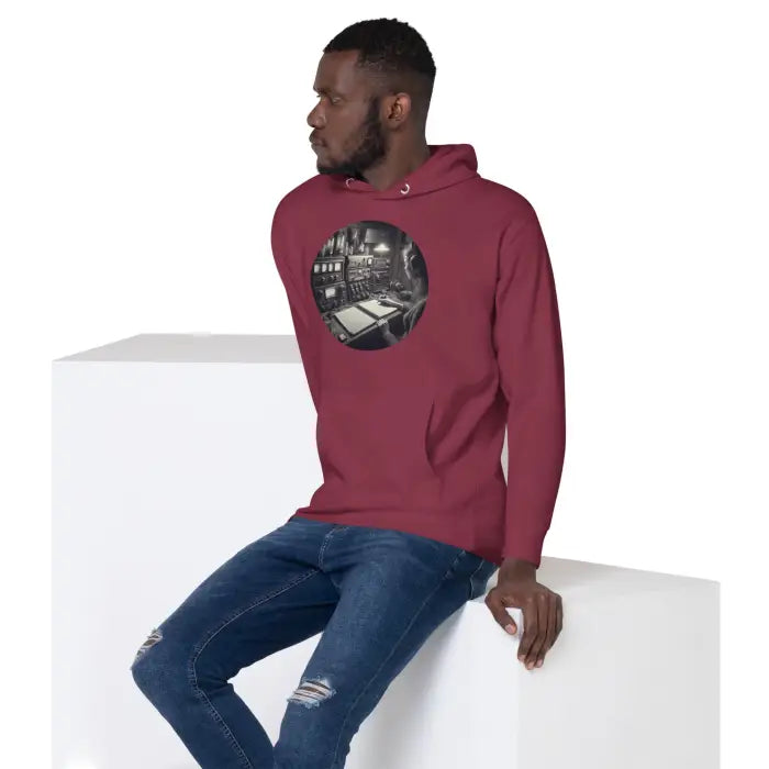 Maroon hoodie with a vintage control room graphic.