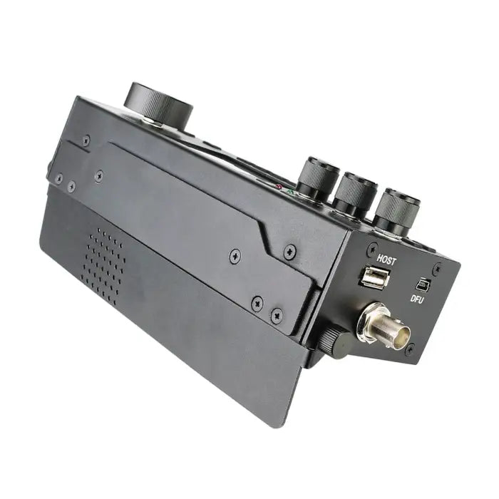 Black electronic device with knobs and ports.