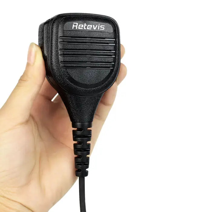 Black handheld microphone with coiled cord.