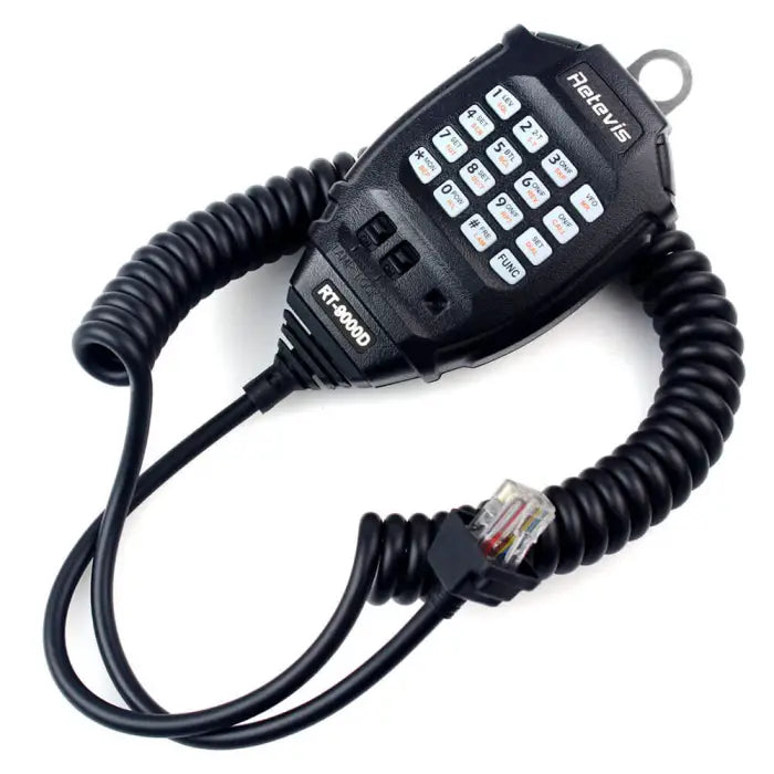 Black handheld radio microphone with coiled cord.