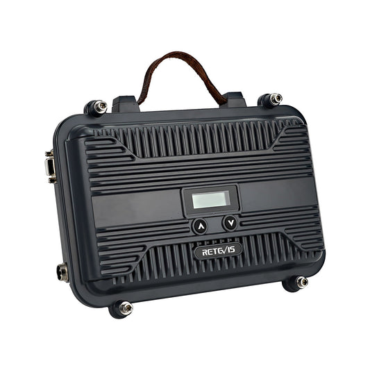 Black, rectangular, portable radio transmitter.