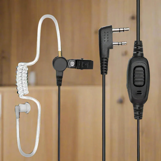 Two-way radio earpiece with coiled acoustic tube.