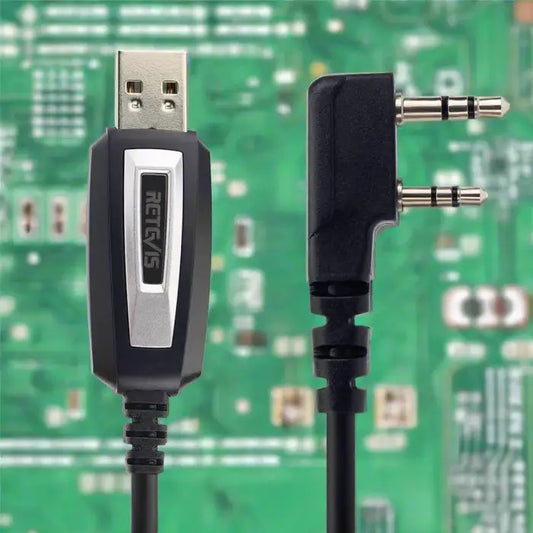 Programming cable with USB and two-prong audio connectors.