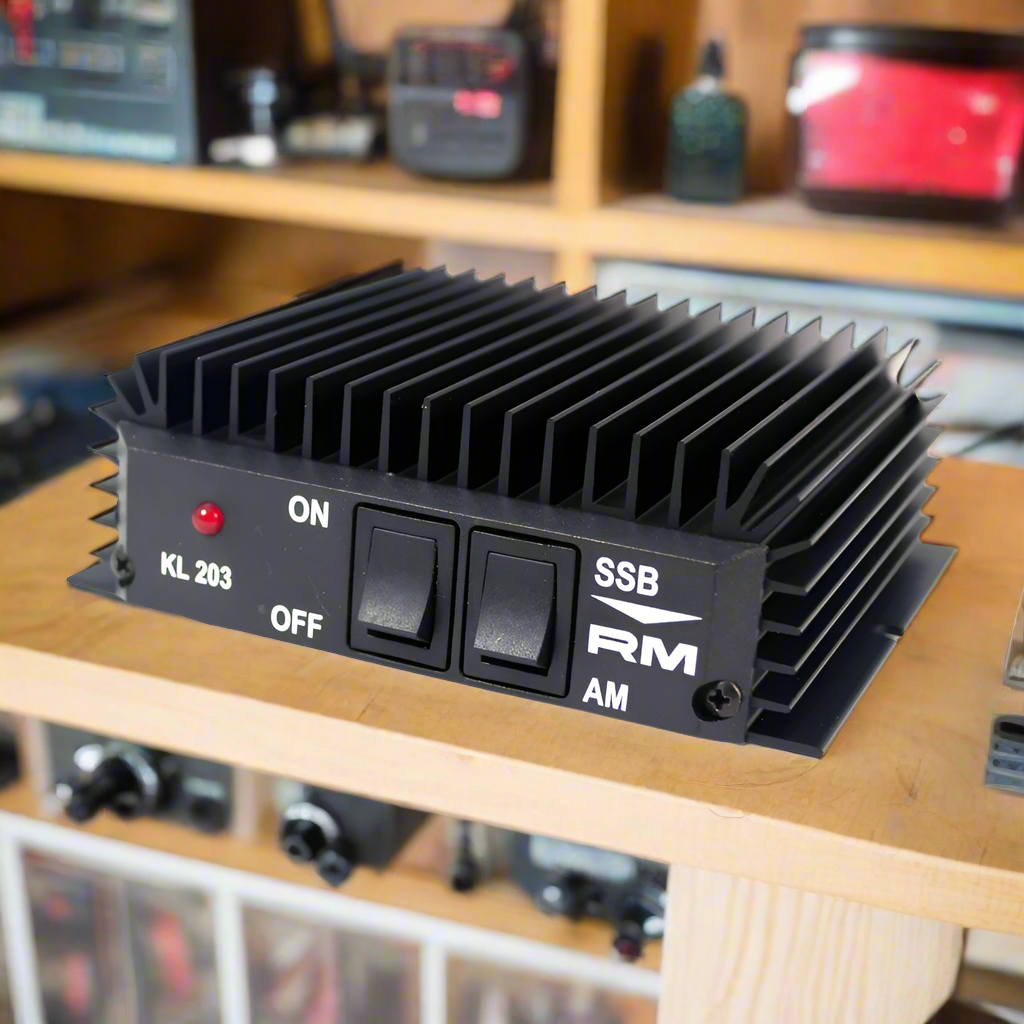 Black metal amplifier with switches.