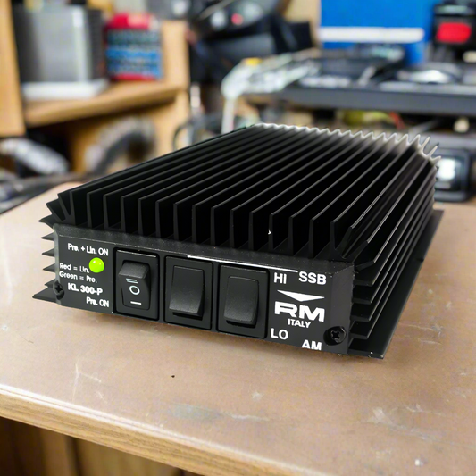 Black RM Italy KL 300-P amplifier with switches and heat sink fins.