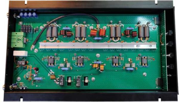Green circuit board with electronic components.