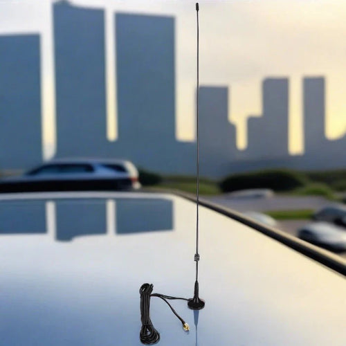 Car antenna with magnetic base and coiled cable.