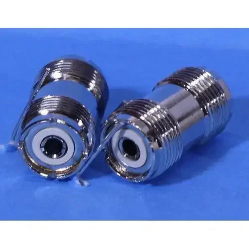 Two shiny metal coaxial cable connectors.