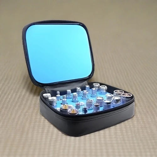 Open black case with watch parts.