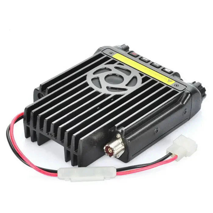 Black metal amateur radio transceiver with a fan and attached power cable