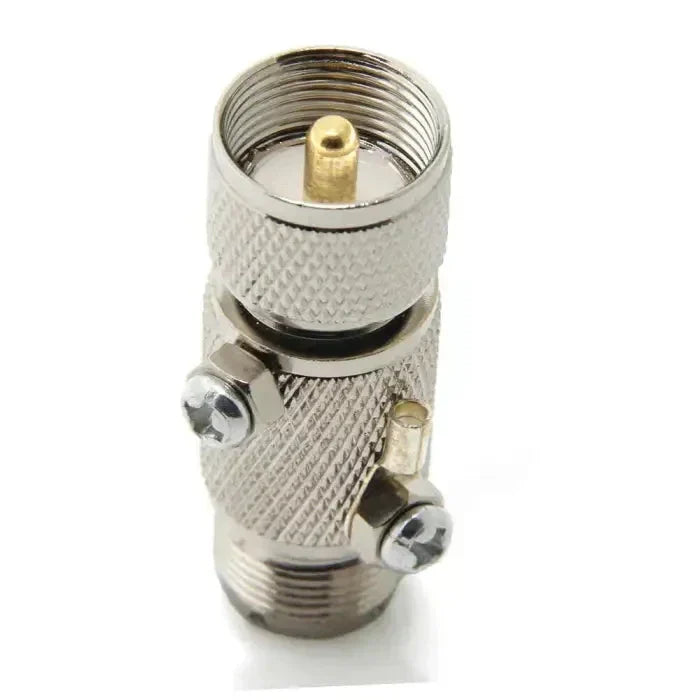 Silver-colored coaxial cable connector.