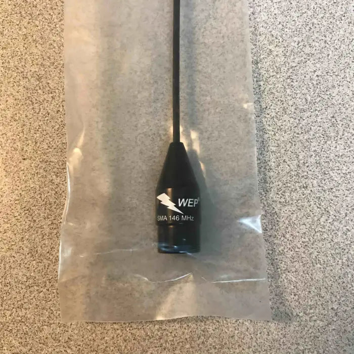 Black antenna in plastic packaging.