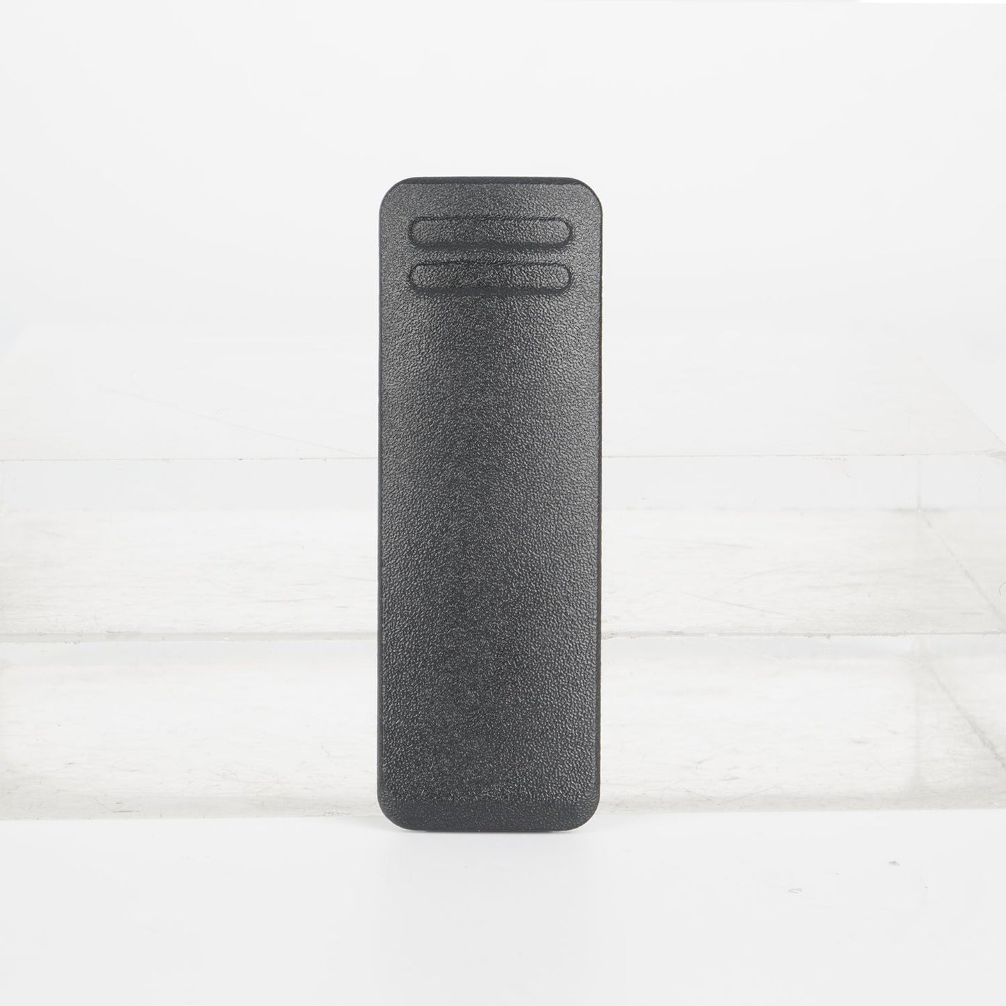 Charcoal gray textured remote control with a minimalist design and two buttons.