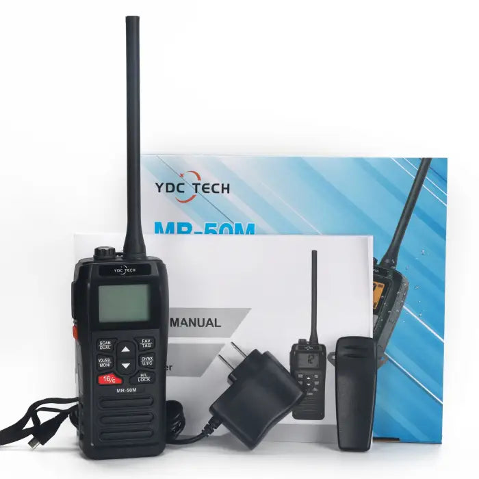 Black two-way radio with accessories and manual
