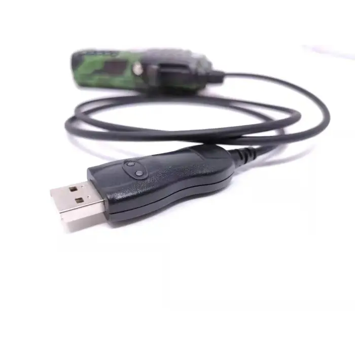 Camouflage two-way radio with USB programming cable.